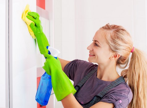 Airbnb cleaning supplies and tidy rental bedroom for guest turnover