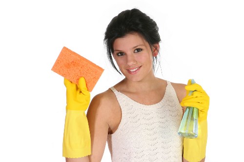 Cleaner removing construction dust during after builders cleaning