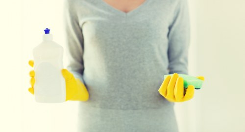 Commercial cleaning supplies and tools used for workplace maintenance