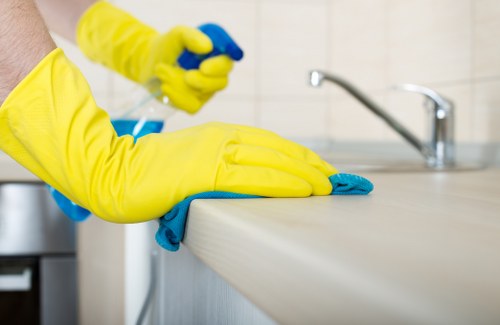 Safe oven cleaning process with gloves and ventilation
