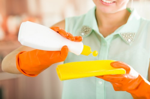 Technician performing stain removal during carpet cleaning